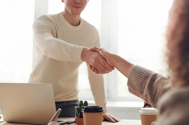Canva-man-and-woman-near-table-1